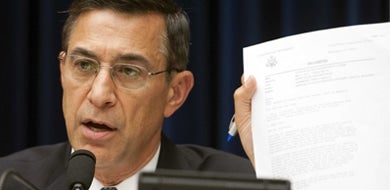 Senator Darrell Issa holding up paper in OGR Committee