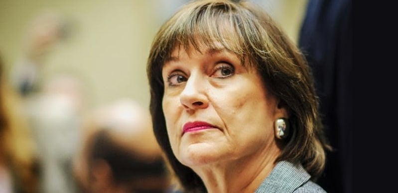 Lois Lerner looking to side, blurry background