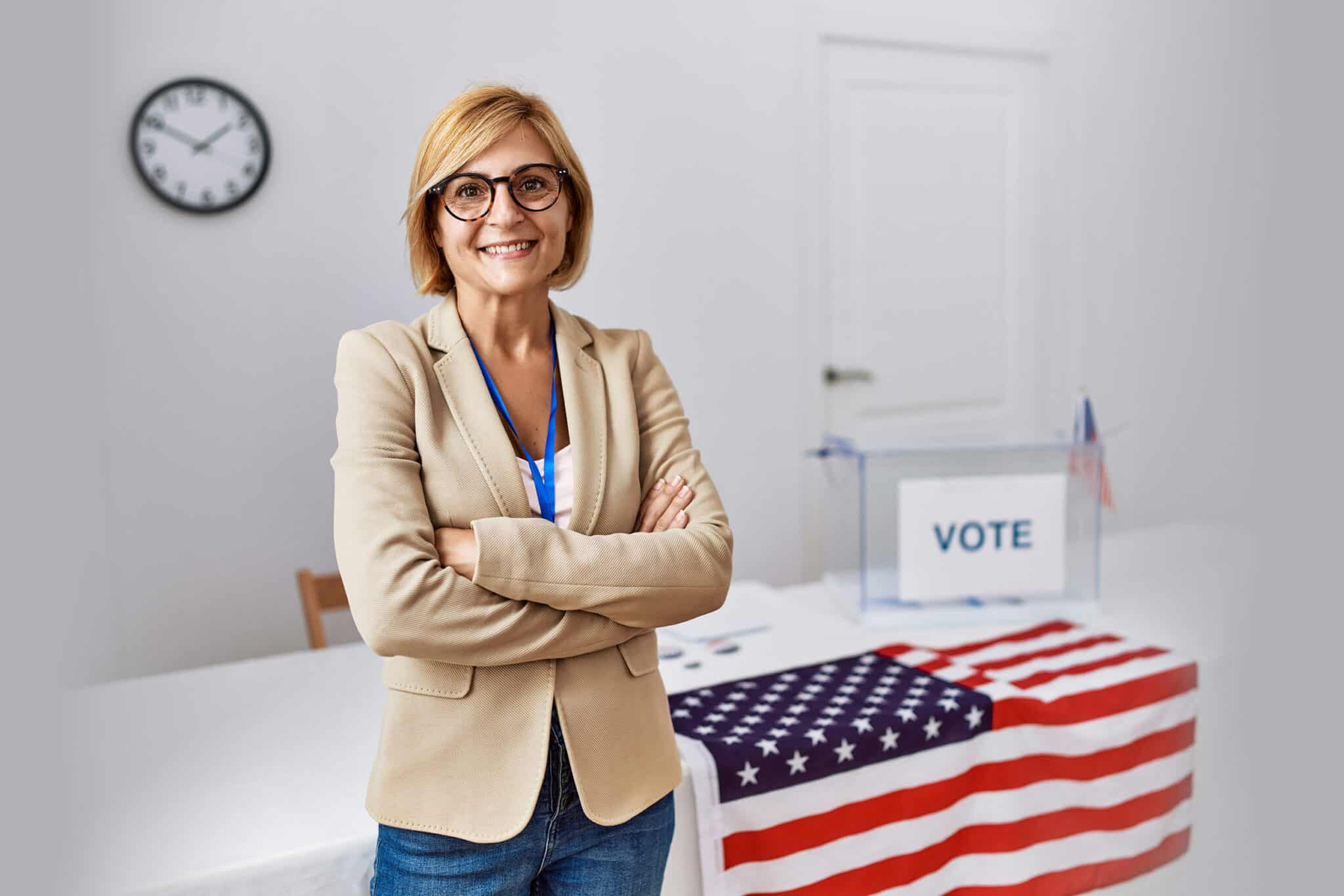 Middle age blonde woman smiling confident with arms crossed gesture at electoral college